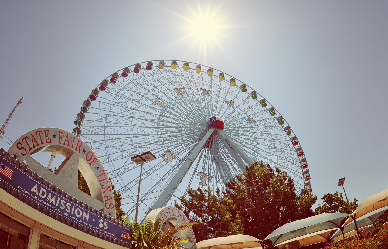 Photo showing a ferris wheel and admissions kiosk